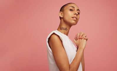 Confident woman with express yourself written on her neck. - obrazy, fototapety, plakaty