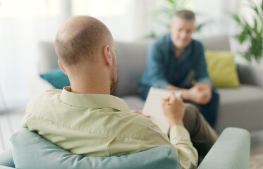Professional therapist meeting a patient in his office