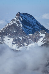 Fototapeta premium The snow-capped mountains of Valtournenche during a sunny day of initiation near the town of Cervinia, Italy - June 2021