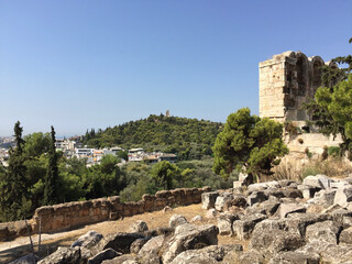 View of the Philopappos Monument on Mouseion Hill (Muse Hill), seen from the vicinity of Odeon of Herodes Atticus on the Athenian Acropolis in Athens, Greece.