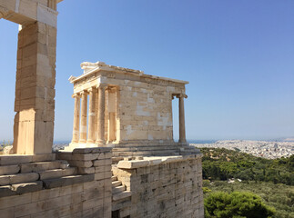 The Temple of Athena Nike is a temple on the Acropolis of Athens, dedicated to the goddesses Athena and Nike. It has a prominent position on a steep bastion to the right of the entrance, the Propylaea
