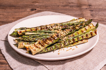 Ripe grilled asparagus. Wooden cutlery, healthy food concept