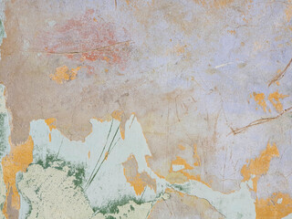 Multi Colored layers of old plaster. Texture of rough cracked pink stucco texture background. Decorative plaster on the wall.