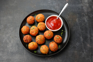 Fried potato cheese balls or croquettes cottage cheese Paneer ball meat balls with tomato sauce on...