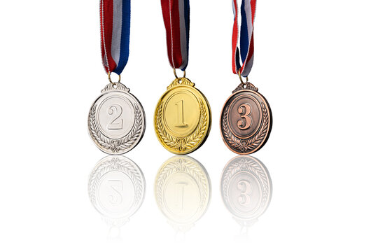 real Gold, silver and bronze medals hanging on red ribbons isolated on white background.