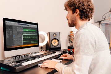 Music producer working at home music studio