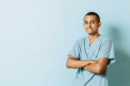 Portrait Of A Smiling Young Latinx Man In Health Uniform Looking At Camera. College Education Concept.