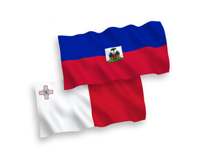 National vector fabric wave flags of Malta and Republic of Haiti isolated on white background. 1 to 2 proportion.
