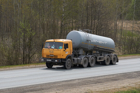 Ruzayevsky District, Mordovia, Russia - May 08, 2021: The Kamaz 65116 with silo-trailer on the intercity road.