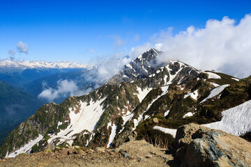 mountain peak with snow and clouds in caucasus mountains landscape