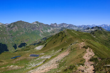 southeren slope of The Main Caucasian Ridge covered with alpine meadows and few mountain lakes