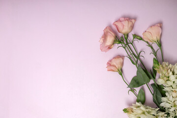 Top view of eustoma,lupin bouquet on the bright pink surface.Empty space