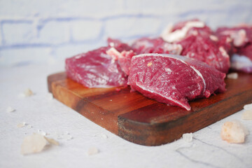 fresh raw red beef meat on chopping board ,