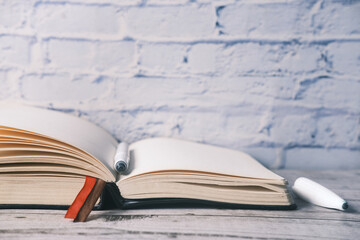 open book and a pen on on table with copy space 