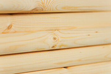 Industrial background. Clean polished wooden bars are stacked. Noble wood. close-up. Back for advertising.