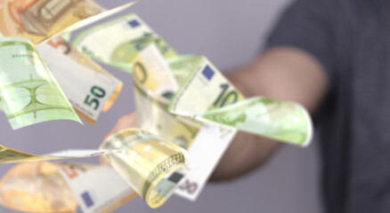 banking euro banknote in hand rain