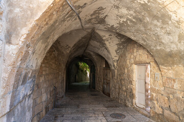 Fototapeta na wymiar The quiet small Ararat Street in the Armenian quarter in the old city of Jerusalem, Israel