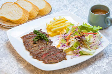beef steak with salad and bread