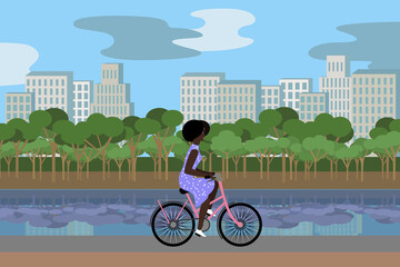 Woman in coat in the park riding bicycles in summer