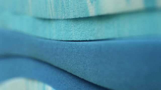 Piles of pastel blue sponge foam sheet materials of different thicknesse