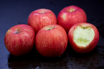pile of ripe apple isolated on black background
