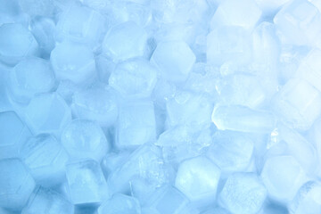 Hexagonal pieces of melted blue ice, background.