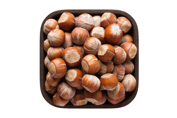 shelled hazelnut in square bowl isolated on white background. organic food, top view.