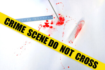 fresh splatter of red blood on white table from crime scene, measuring ruler, blood sample...