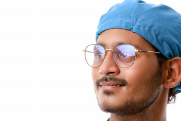 Handsome male doctor standing on white background.