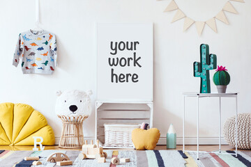 Stylish scandinavian kid room with mock up poster, toys, teddy bear, plush animal, natural pouf and children accessories. Modern interior with beige background walls. Template. Design home staging. © FollowTheFlow