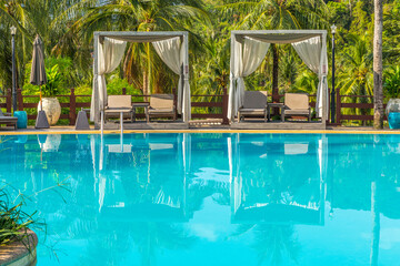 Relax beach chair near by swimming pool