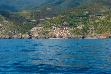 Riomaggiore village seen from the Mediterranean sea, Cinque Terre National Park in Liguria, La Spezia, Italy, Europe. UNESCO world heritage site. 