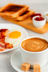breakfast scrambled eggs coffee toast bacon