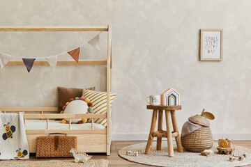 Stylish composition of cozy scandinavian child's room interior with wooden bed, coffee table, plush and wooden toys and hanging decorations. Creative wall, carpet on the floor. Copy space. Template.