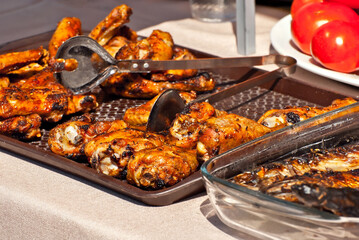 Slice pieces of meat on the grill. barbecue at the festival. Roast beef on the table.