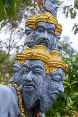 Many heads statue on the street near buddhist temple, Thailand