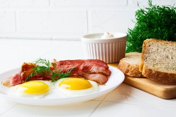 breakfast with fried eggs and bacon