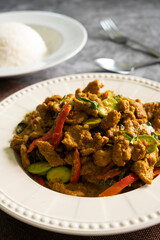 Stir-fried pork with Thai red curry paste