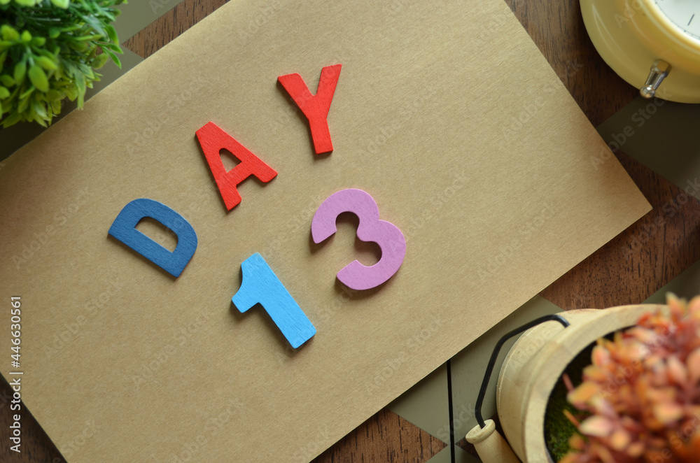 Fototapete day 13. cover design in natural concept with the alphabet on brown notebook on the wooden table for 