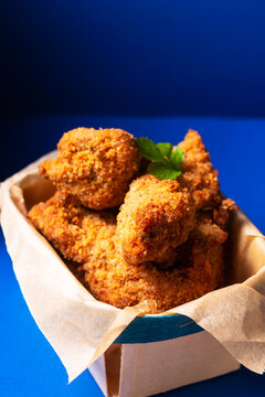 Food Concept Homemade Herbs Crispy Fried Chicken Tenders In Wooden Tray With Copy Space