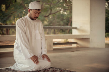 Asian islam man prayer,Young Muslim praying,Ramadan festival concept