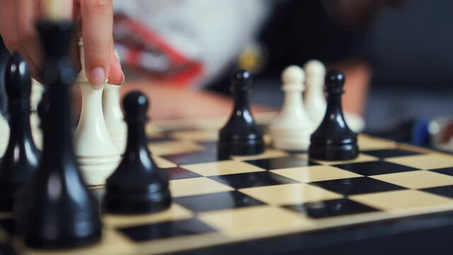 The chess player is checkmating. Chess game, strategy game