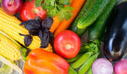 Assorted assorted fresh vegetables on a wooden surface. Healthy food concept