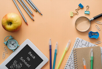 School subjects in the form of a frame on an orange background. Back to school concept. Flat lay
