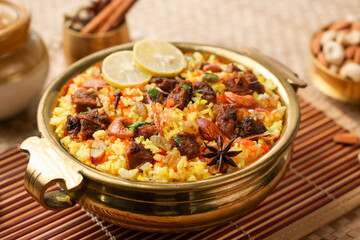 Beef Biryani Mutton biryani , Gosht or lamb biriyani Hyderabadi Dum biriyani with raita yoghurt dip special occasion Indian festival food Ramadan , Eid Hyderabad Kerala India Sri Lanka. Lankan food.	