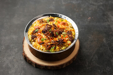 Beef Biryani Mutton biryani , Gosht or lamb biriyani Hyderabadi Dum biriyani with raita yoghurt dip special occasion Indian festival food Ramadan , Eid Hyderabad Kerala India Sri Lanka. Lankan food.	