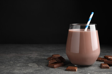 Delicious chocolate milk on grey table. Space for text