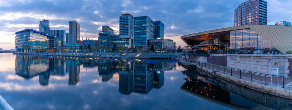 View of MediaCity UK and restaurant at dusk, Salford Quays, Manchester, England