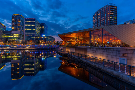 View of MediaCity UK and restaurant at dusk, Salford Quays, Manchester, England