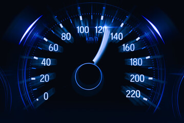 The speedometer on the dashboard of the car shows the excess speed. Speed motion tech background.